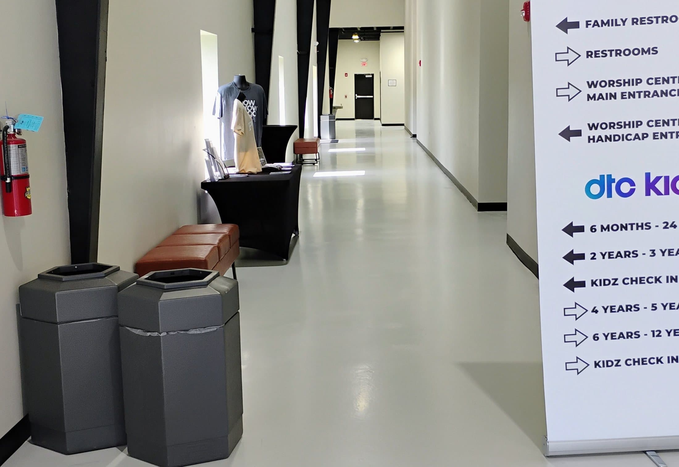 The same corridor after installation, finished in a high-gloss light floor coating.