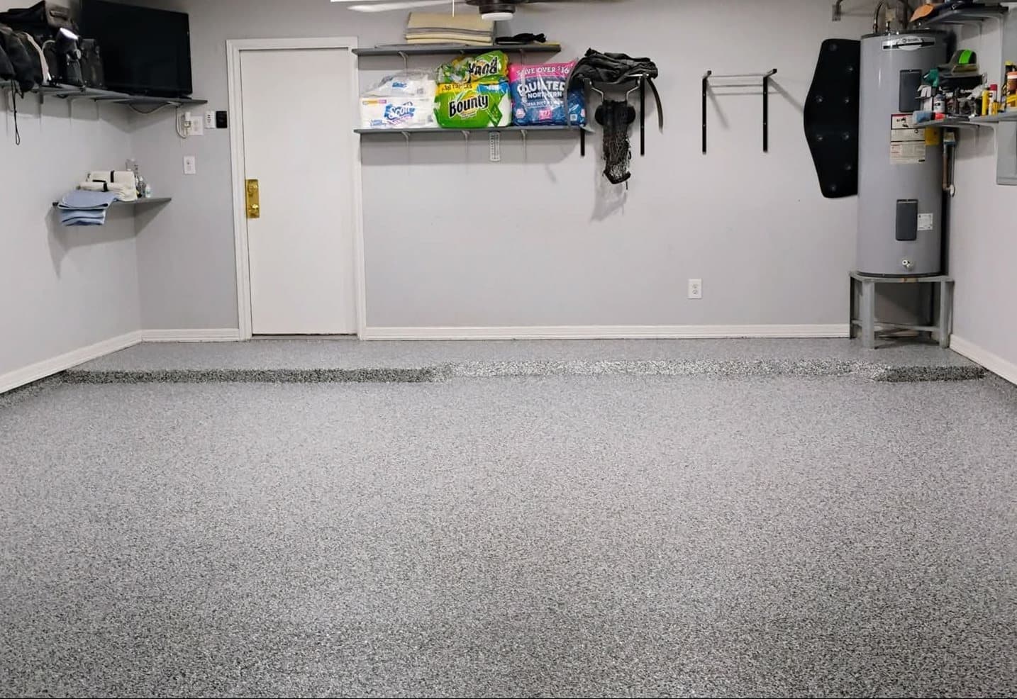 The same two-car garage after installation, finished in a grey flake floor.